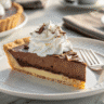 layered chocolate delight dessert slice on white plate