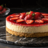 Luxury strawberry cheesecake slice with mirror glaze
