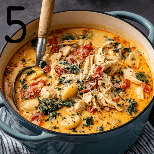 Cream cheese and Parmesan stirred into the pot of Marry Me Chicken Soup until smooth and fully melted.