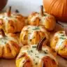 Delicious pizza-stuffed pumpkins served for a cozy fall feast