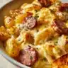 Delicious Cheesy Ranch Potatoes with savory smoked sausage on a plate.