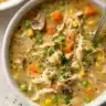 Delicious Chicken Pot Pie Soup served in a bowl with vegetables and herbs
