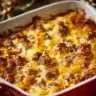 Sausage hash brown breakfast casserole served in a dish