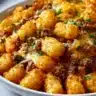 Deliciously baked Tater Tot Casserole with melted cheese and savory toppings.
