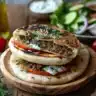 Delicious Greek Smashed Pita served with herbs and spices.