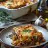 Delicious ground beef casserole ready to serve with melted cheese on top.