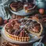 Deliciously baked pecan tarts with a rich filling on a wooden table