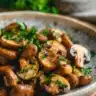 Delicious restaurant-style sautéed mushrooms served on a plate