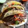 Delicious slow cooker brisket tacos served with fresh toppings