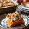 Delicious sweet potato casserole topped with marshmallows and pecans.