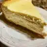 Slice of homemade Cream Cheese Pound Cake with a golden crust and creamy texture.