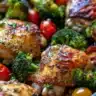 Lemon Garlic Chicken served with colorful veggies on a plate.