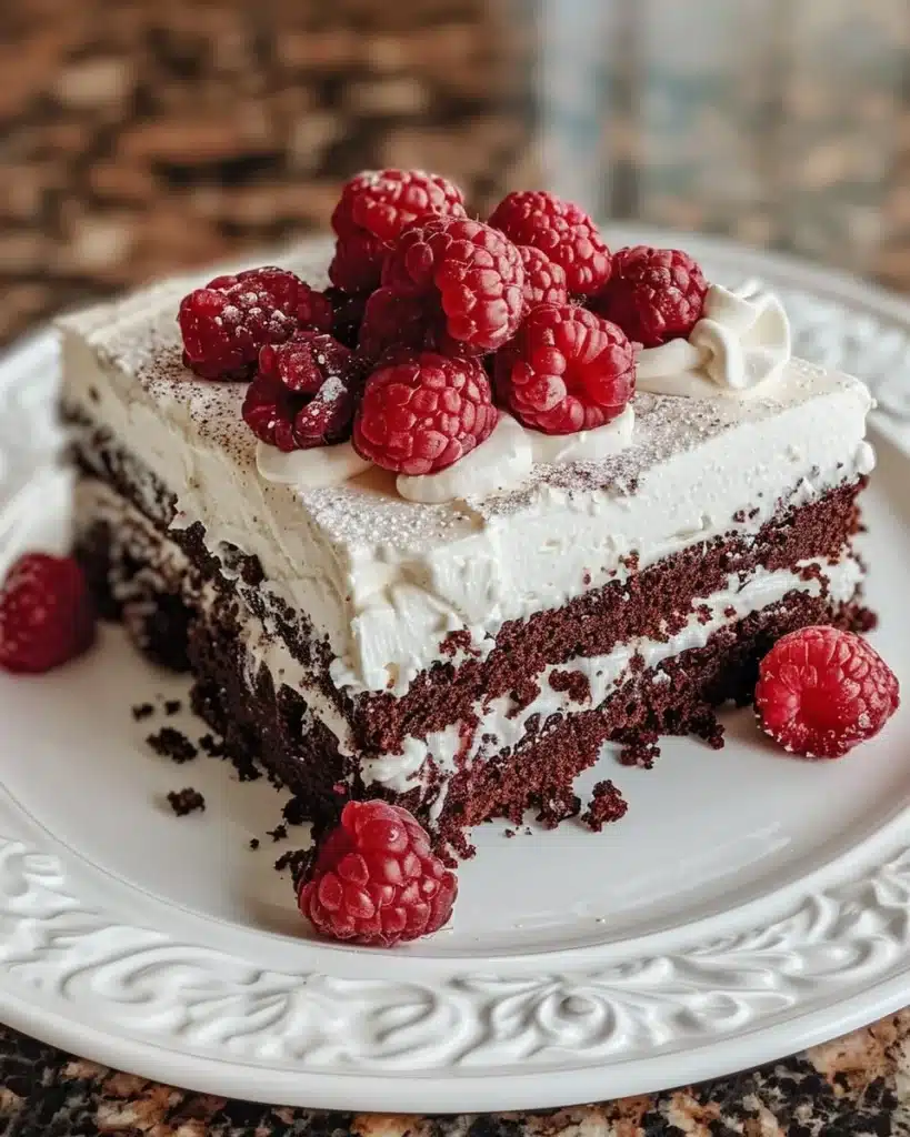 Delicious raspberry cheesecake brownies topped with fresh raspberries