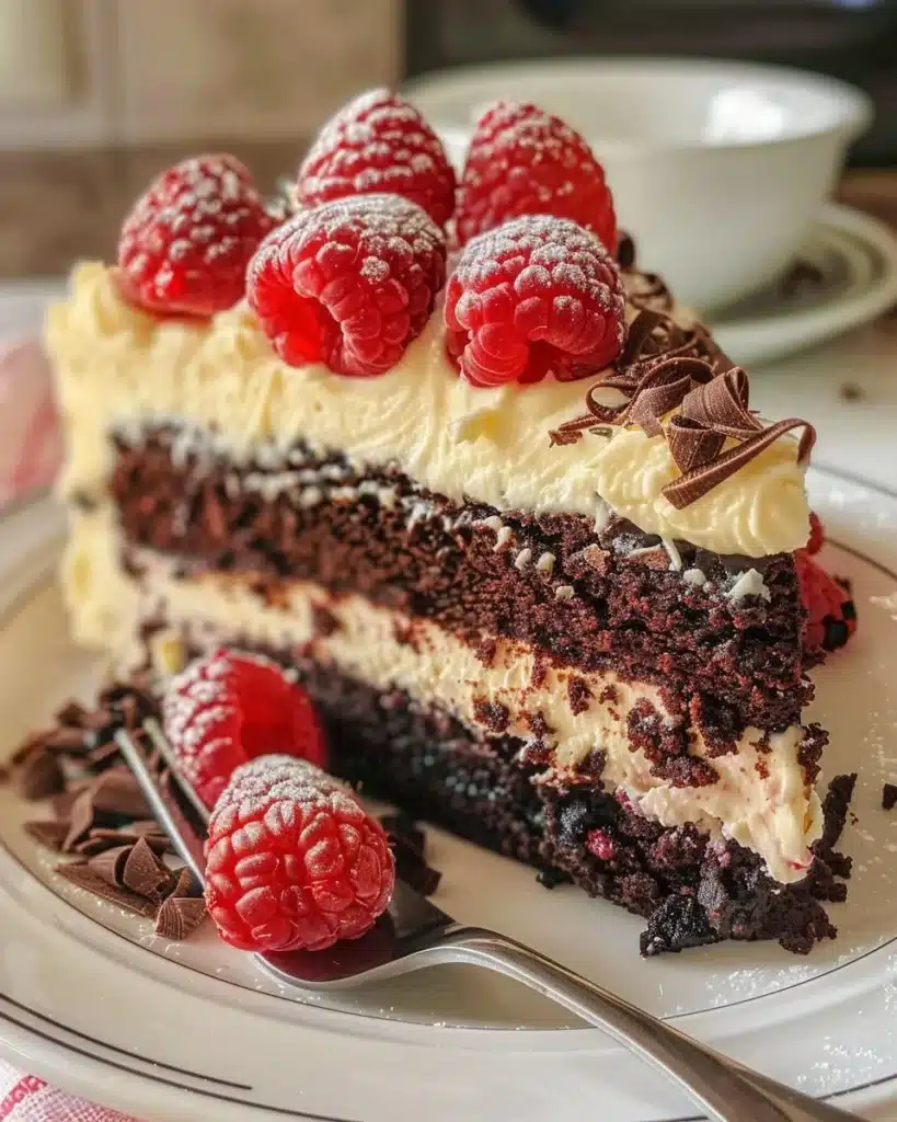 Delicious Raspberry Cheesecake Brownies with creamy topping and raspberry swirls