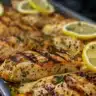 Delicious grilled chicken served with fresh herbs and vegetables