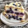 Lemon Blueberry Layer Cake with fresh blueberries and creamy frosting
