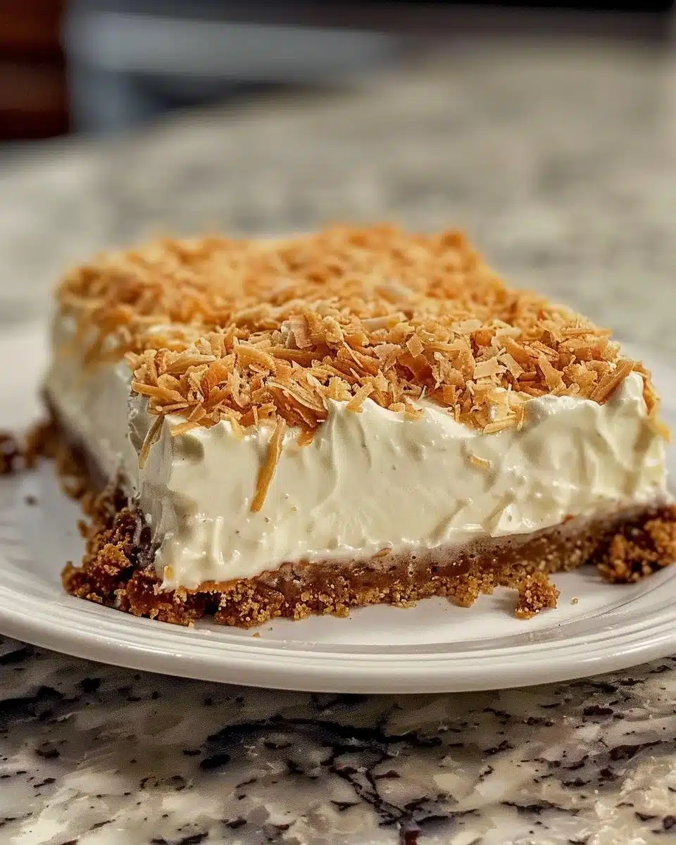 No-Bake Carrot Cheesecake topped with nuts and a slice of carrot