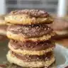 Freshly baked Nutella cookies stacked on a plate