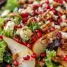 Fresh Pear and Pomegranate Salad with greens and dressing