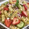 Bowl of Strawberry Fields Pasta Salad with vibrant ingredients