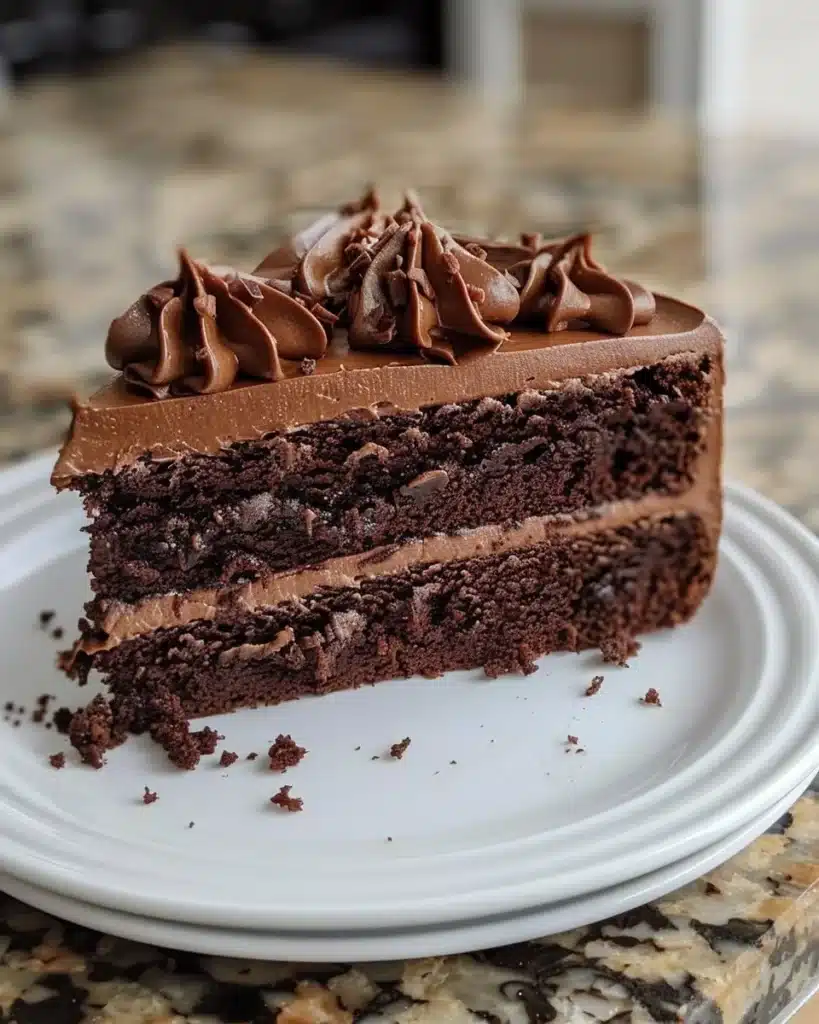 Delicious Texas Sheet Cake topped with chocolate icing on a rustic wooden table.