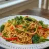 Delicious Asian-style Spaghetti with colorful vegetables and Asian sauces.