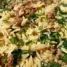 Creamy ground beef orzo served in a bowl with fresh parsley.