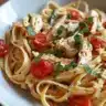 Creamy Mozzarella Chicken Linguine with tomatoes served in a bowl