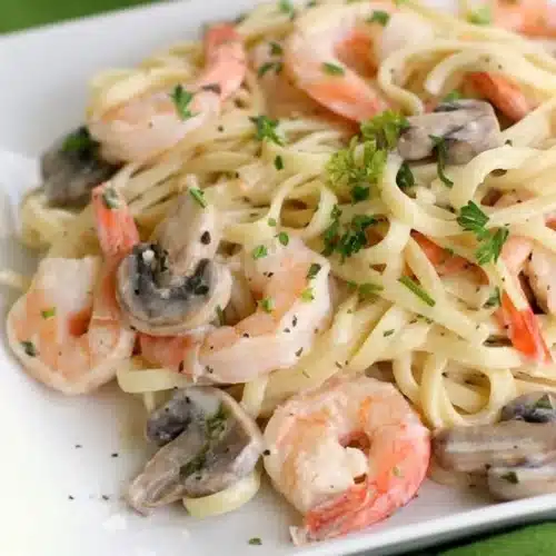 Delicious creamy shrimp pasta with garlic and herbs served in a bowl