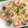 Delicious creamy shrimp pasta with garlic and herbs served in a bowl