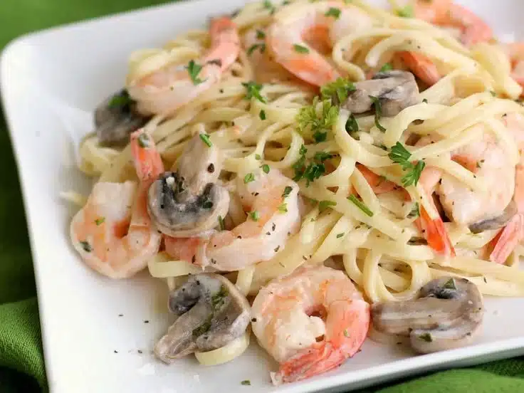 Delicious creamy shrimp pasta with garlic and herbs served in a bowl