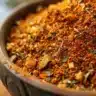 Homemade blackened seasoning in a bowl with spices and herbs