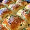 Freshly baked Korean cream cheese garlic buns with a golden crust