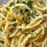 Delicious lemon pasta dish garnished with fresh herbs