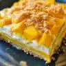 Delicious Mango Float dessert with mango slices and whipped cream