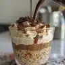 Delicious Triple Chocolate Tiramisu dessert topped with cocoa and chocolate shavings