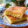 Deliciously baked cornbread served on a wooden table with butter and honey