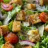 Delicious Olive Garden Salad with fresh ingredients and Italian dressing.