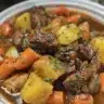 A bowl of Big Papa's Homemade Beef Stew served with fresh ingredients and rich flavors.