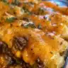 Cheesy Tater Tot Casserole baked to golden perfection, served in a dish.