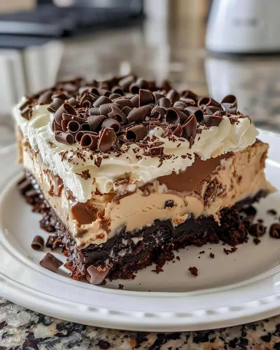 Sliced Chocolate Mocha Cream Pie topped with whipped cream and chocolate shavings
