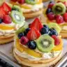 Colorful fruit pizza topped with a variety of fresh fruits