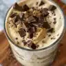 Delicious bowl of dark chocolate peanut butter ice cream garnished with chocolate shavings