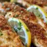 Crispy homemade chicken schnitzel served with lemon and parsley.