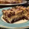 Slice of Double Chocolate Banana Bread surrounded by chocolate chips and banana slices