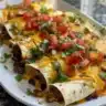 Easy sheet pan quesadillas served on a plate with toppings