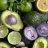 Bowl of flavorful guacamole with fresh ingredients like avocado and lime