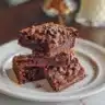 Decadent Flourless Chocolate Cake topped with chocolate ganache and berries