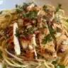 Garlic Parmesan Chicken Spaghetti in spicy Cajun cream sauce served in a bowl