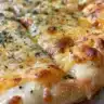 Homemade cheddar cheese crackers on a wooden board